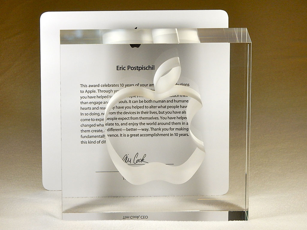 Lead crystal block with Apple logo in front of Apple ten-year service award letter